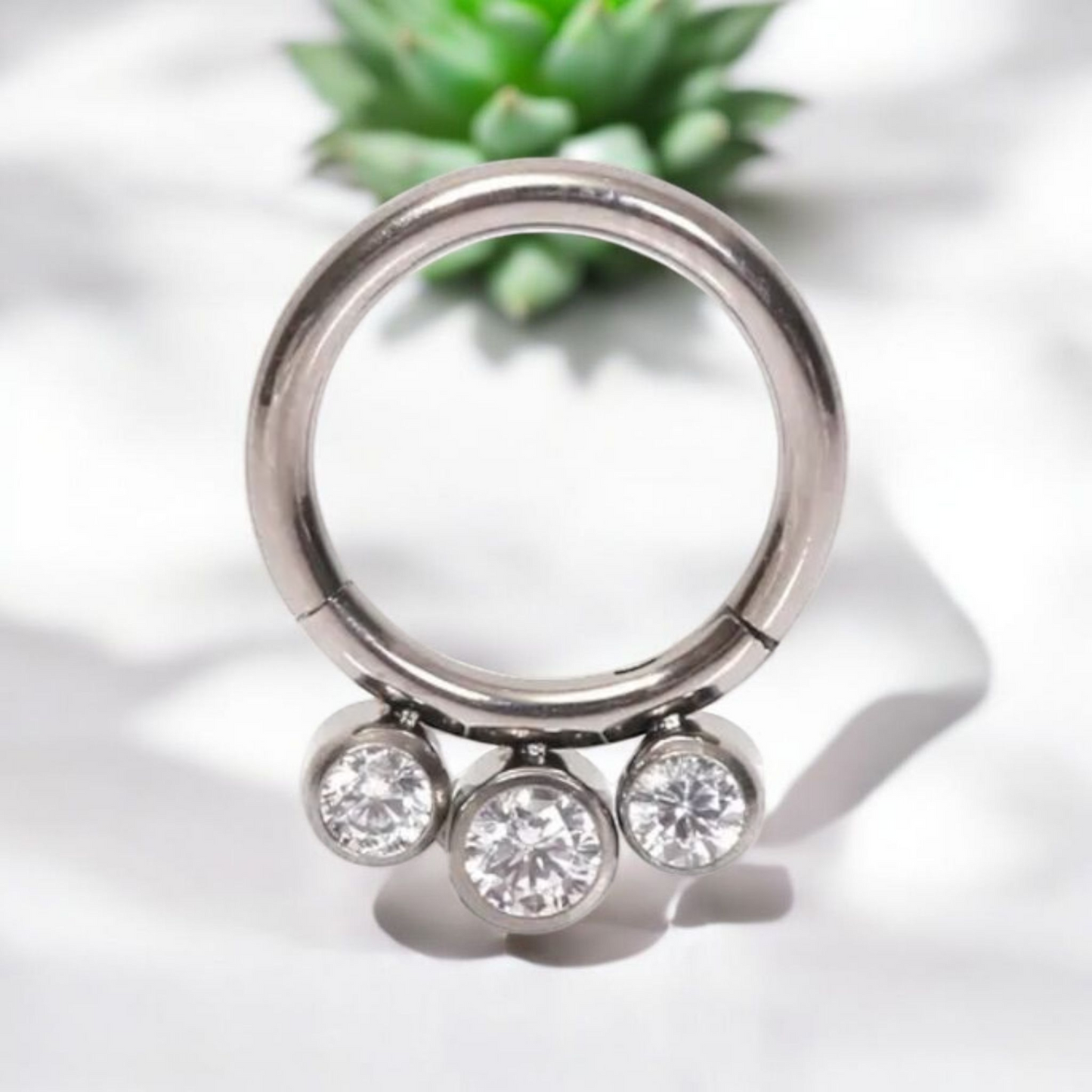 *Titanium & Triple Clear Cubic Zirconia Hinged Ring