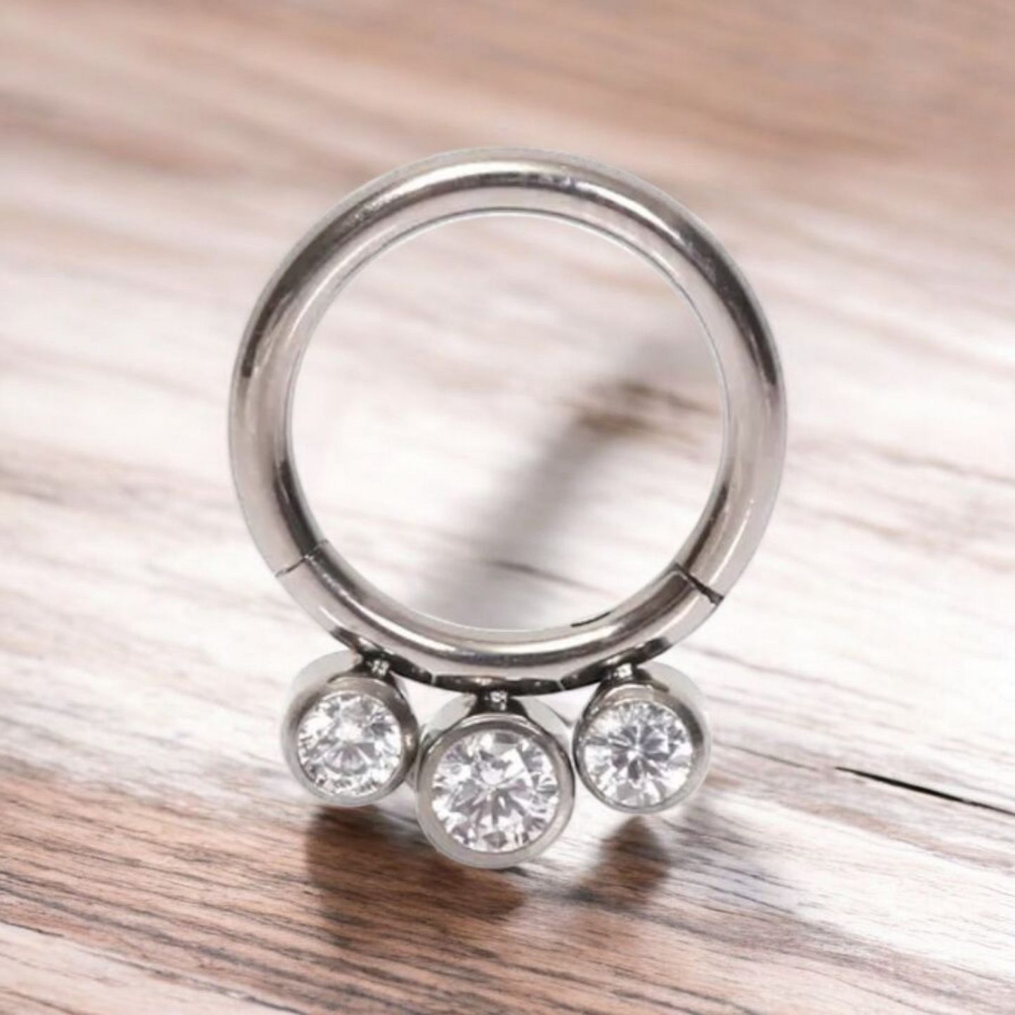 *Titanium & Triple Clear Cubic Zirconia Hinged Ring