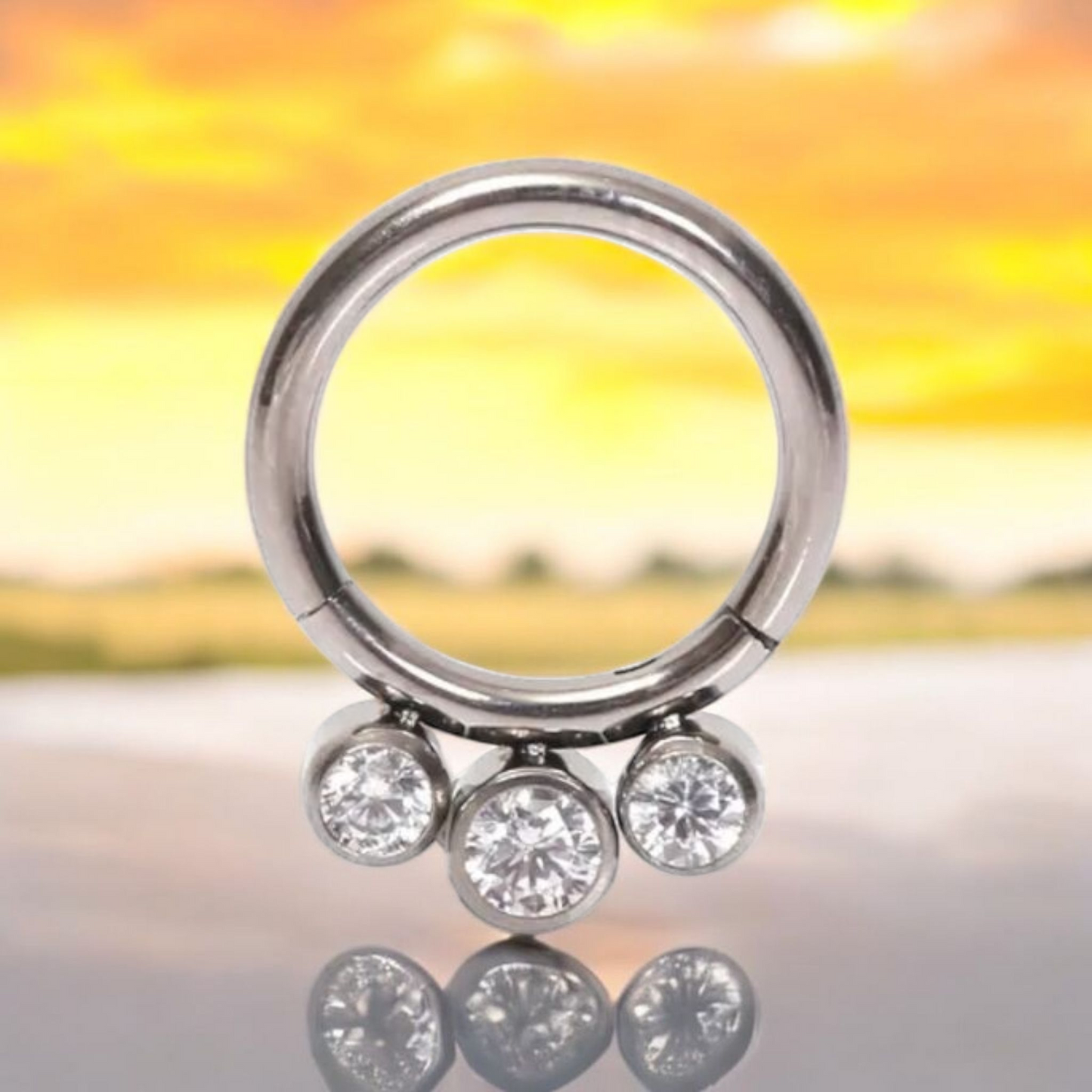 *Titanium & Triple Clear Cubic Zirconia Hinged Ring