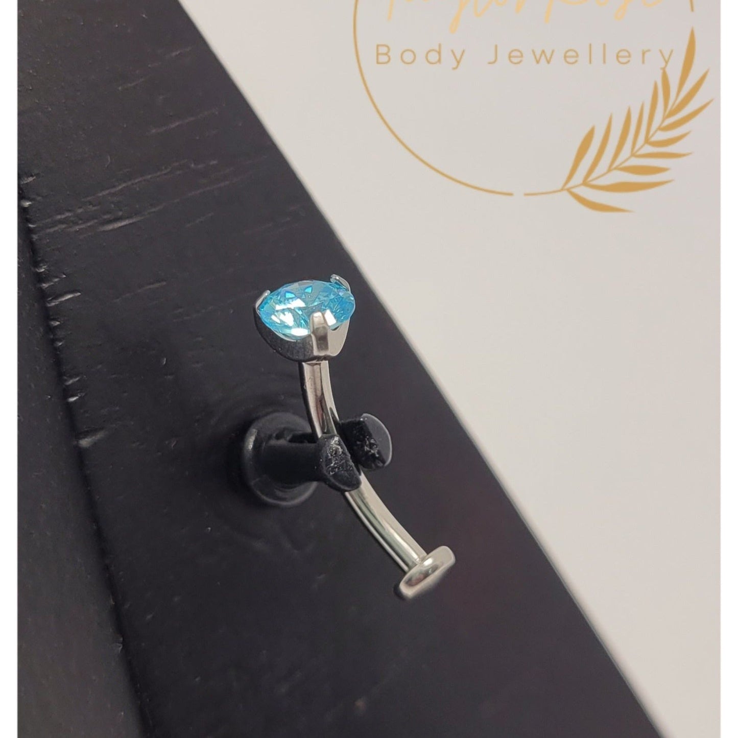 Floating Navel Curve Aqua Blue Prong Set Cubic Zirconia