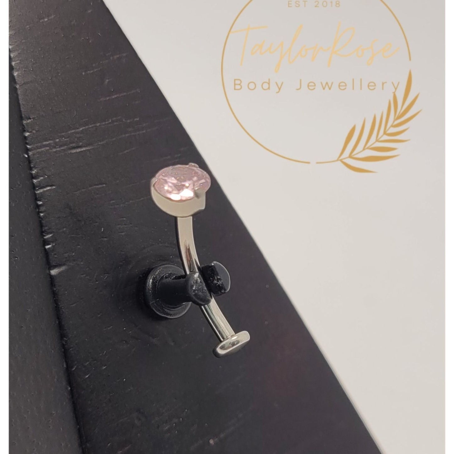 Floating Navel Curve Pink Prong Set Cubic Zirconia